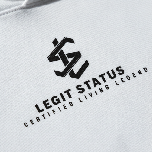 Close-up of Legit Status geometric LS logo in black on white hoodie fabric